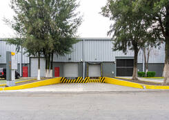 
                                	        MEX001: MEX001 Exterior. Dock doors and ramp
                                    